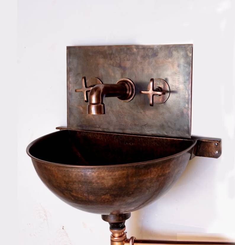 Handmade copper wall-mounted bathroom sink with matching faucet
