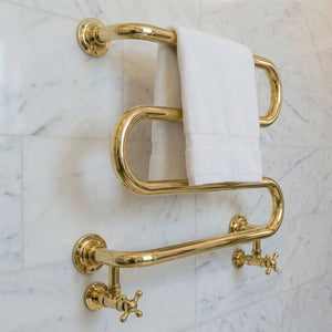 Handmade unlacquered brass hydronic towel warmer with serpentine rails and crosshead valves