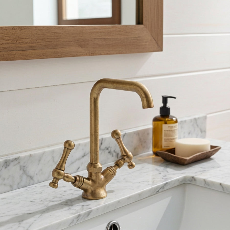 Unlacquered brass gooseneck basin tap with cross handles