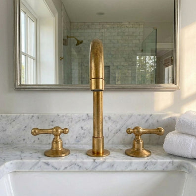 Unlacquered Brass Widespread Vanity Faucet with Lever HandlesUnlacquered Brass Widespread Vanity Faucet with Lever Handles