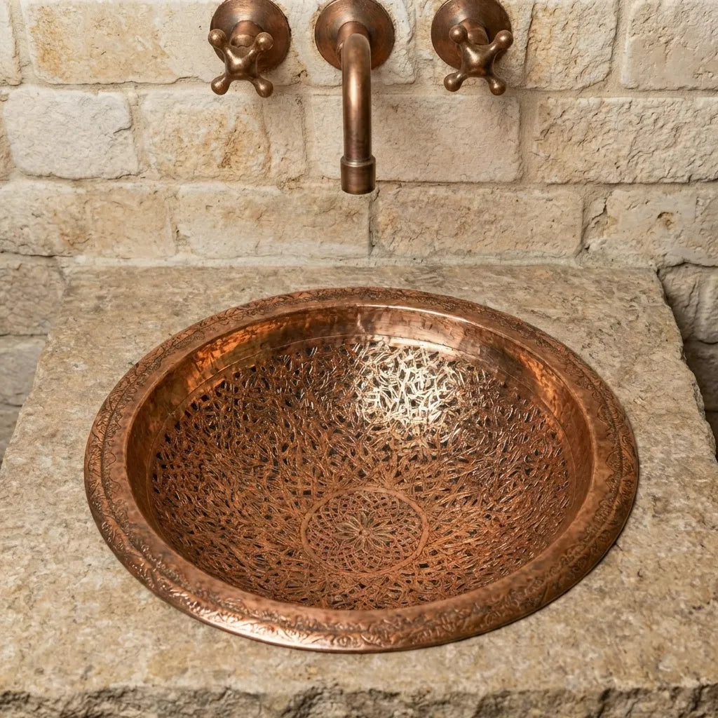 Rustic copper bathroom sink with engraved basin and antique wall mount tap