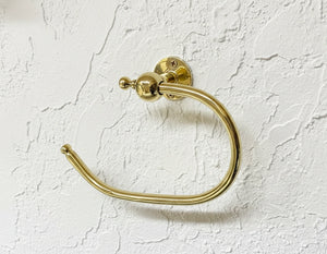 unlacquered brass toilet paper holder – vintage wall-mounted bathroom hardware with solid brass finish.