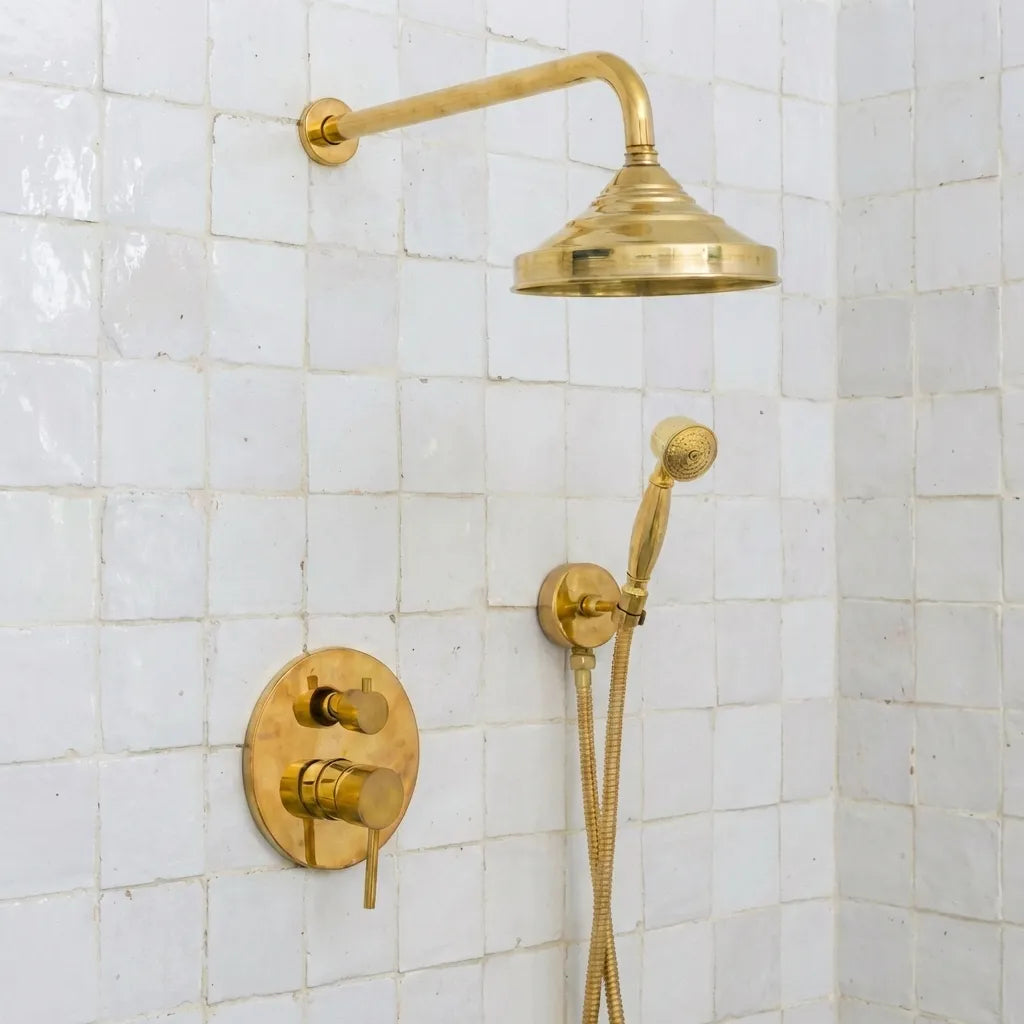 Solid brass rain shower head with curved arm and handheld shower in vintage finish