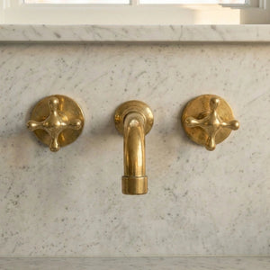Three hole wall mounted unlacquered brass faucet