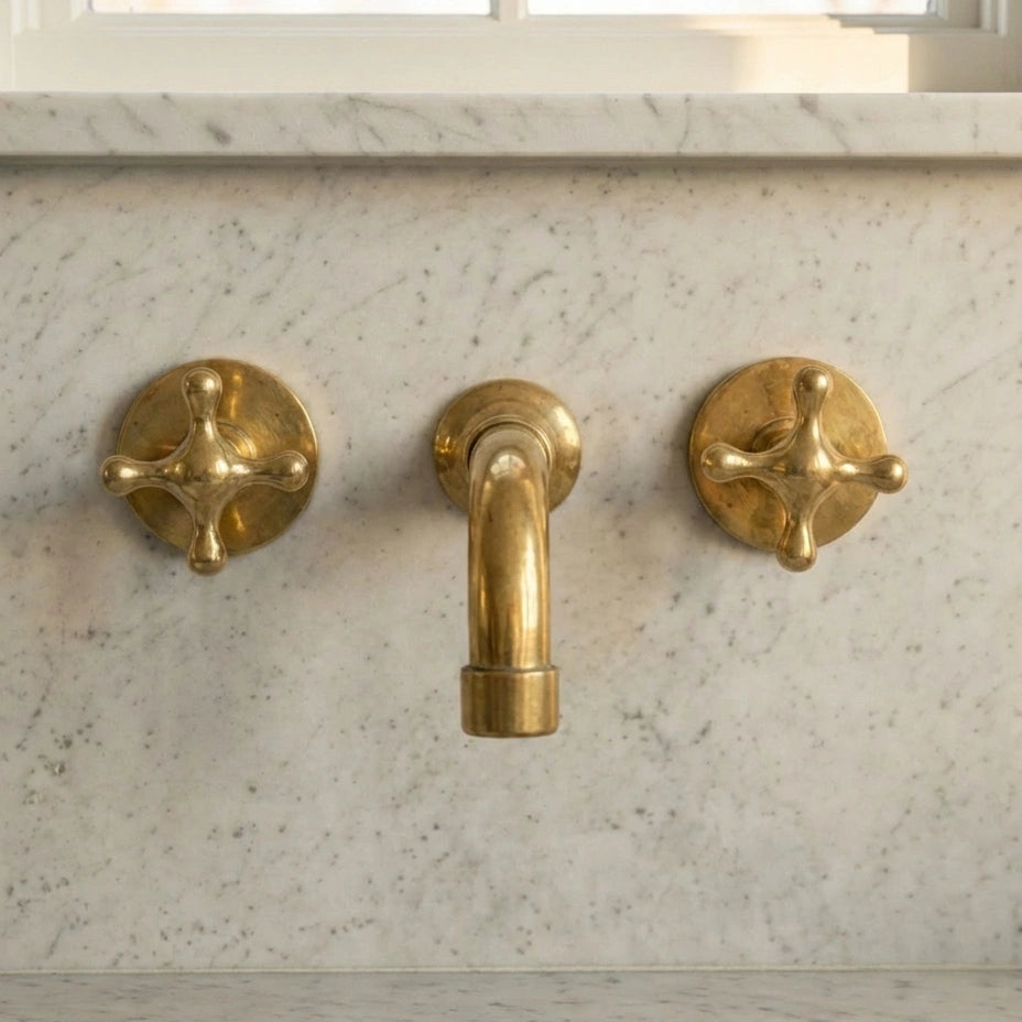 Three hole wall mounted unlacquered brass faucet