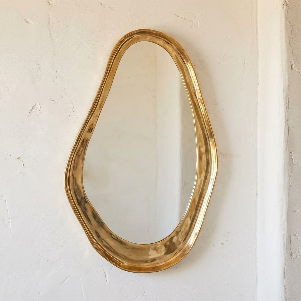 Unlacquered brass organic wall mirror with sculptural handmade frame