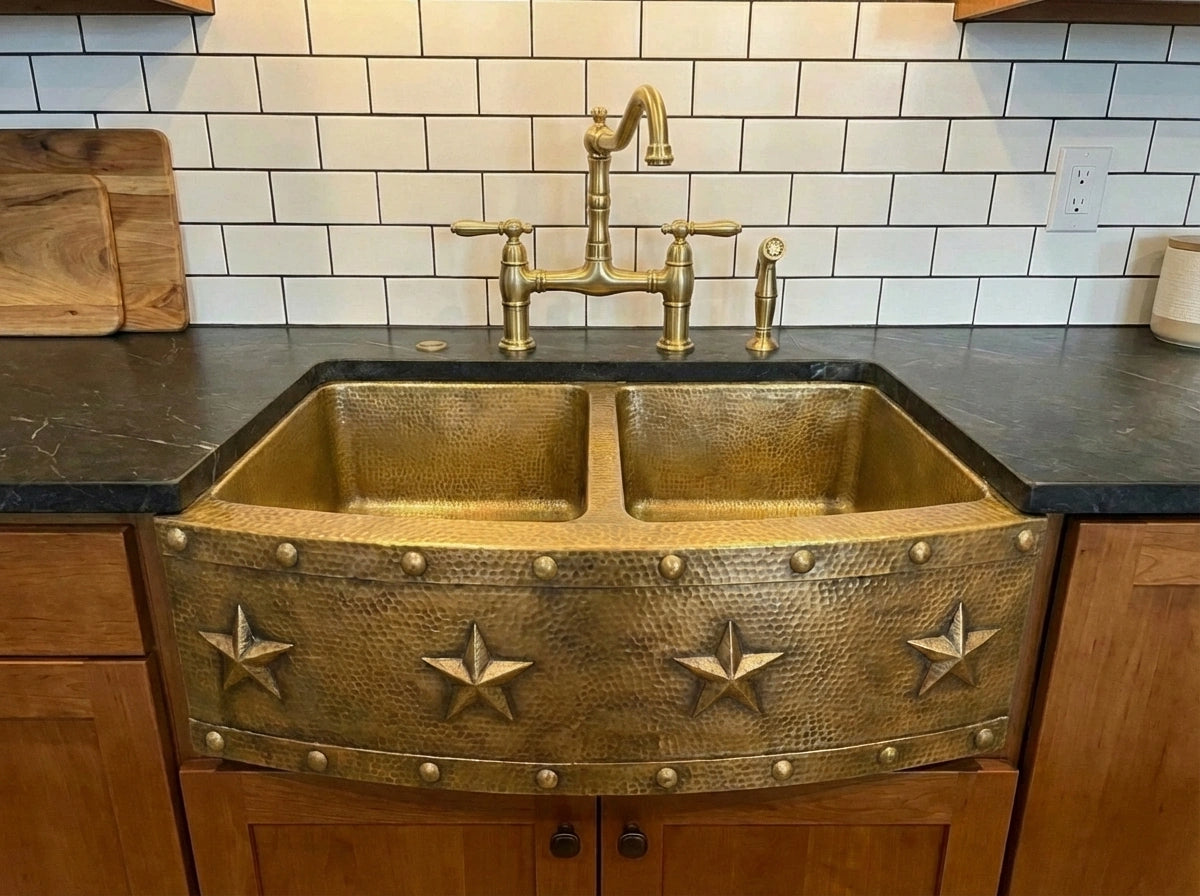 Renovated farmhouse kitchen overview showing brass fixtures and natural materials