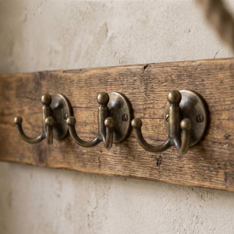 The hook is a solid antique brass double robe hook.