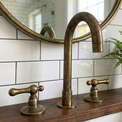 Unlacquered Brass Widespread Vanity Faucet with Lever HandlesUnlacquered Brass Widespread Vanity Faucet with Lever Handles
