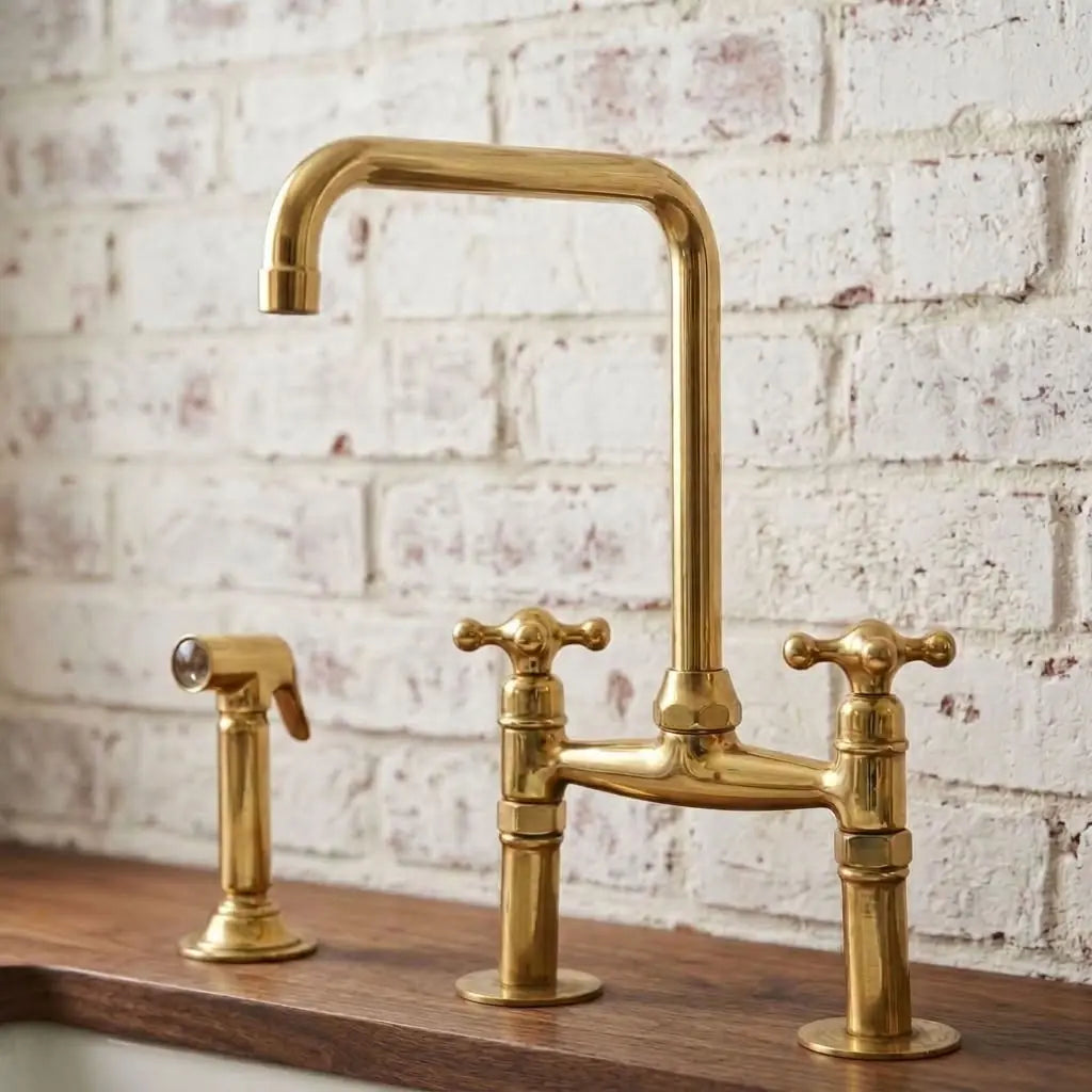 Unlacquered brass bridge kitchen faucet with cross handles and matching side sprayer