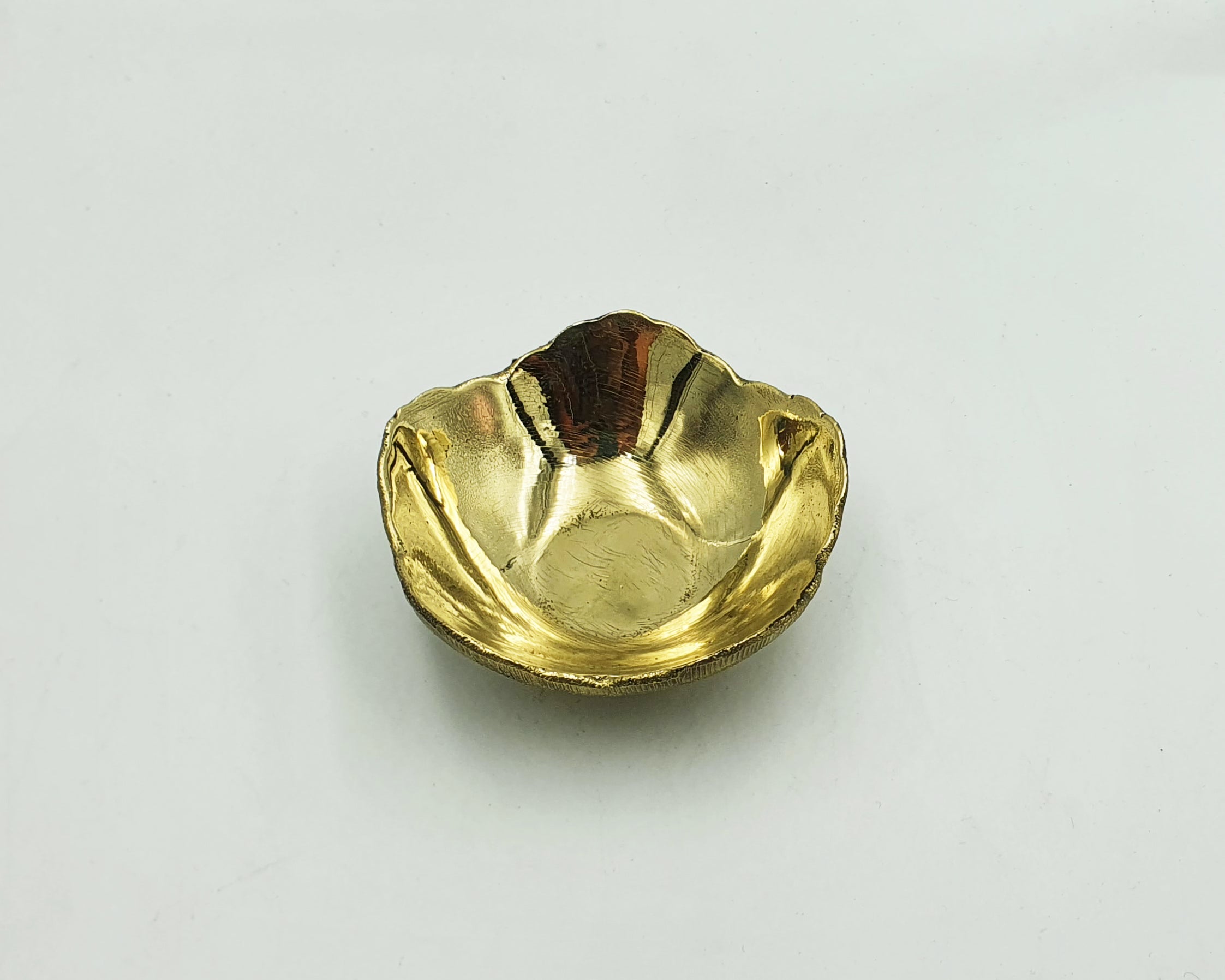 unlacquered brass candle holder