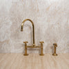 Afbeelding laden in Galerijviewer, Unlacquered Brass Bridge Kitchen Faucet with Sprayer Zayian