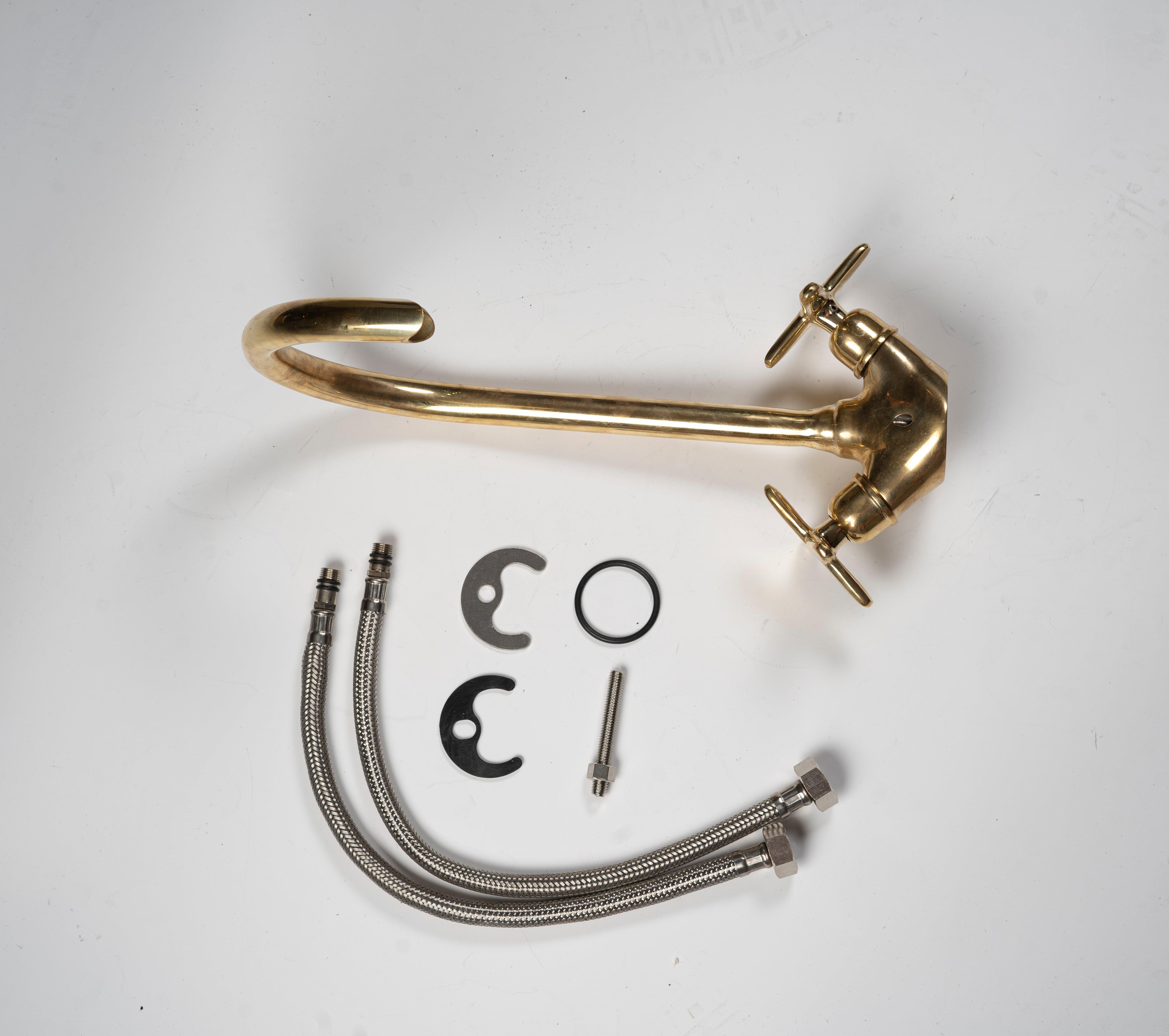 Unlacquered brass gooseneck bathroom faucet with flexible supply lines and installation parts