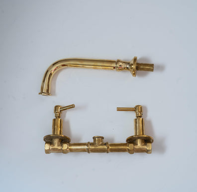 Solid brass wall-mount bathroom faucet parts with curved spout and lever handles