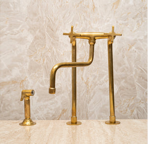Tall unlacquered brass bridge kitchen faucet with cross handles and matching side sprayer