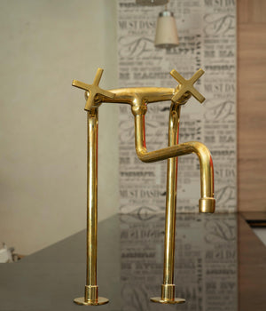 Tall unlacquered brass bridge kitchen faucet with star cross handles