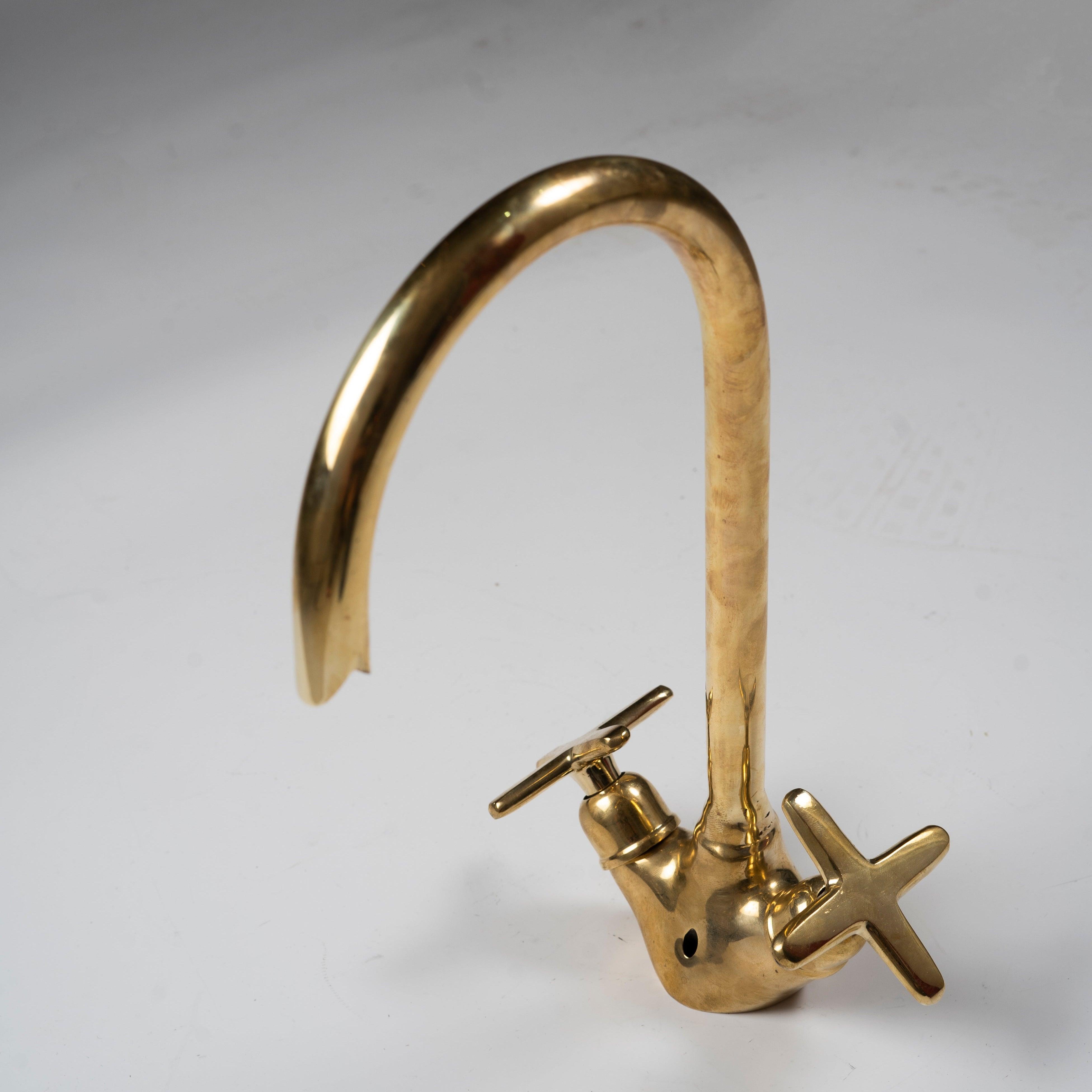 Unlacquered brass gooseneck bathroom sink faucet with cross handles