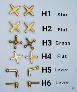 Unlacquered brass shower handle options with star, flat, cross and lever styles
