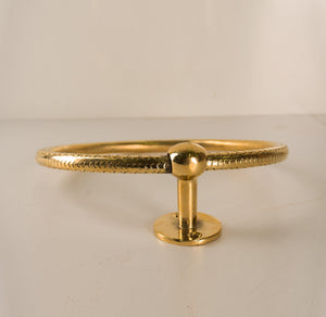 Front profile of an unlacquered brass towel ring with decorative circular rail
