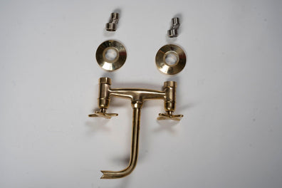 Unlacquered brass wall-mounted tub filler faucet components with cross handles and curved spout